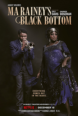 A Voz Suprema do Blues: Poster do filme em que o título em inglês (Ma Rainey's Black Bottom) está no topo e os créditos na parte inferior. Como imagens principais estão os astros Chadwick Boseman e Viola Davis, ele tocando um instrumento e ela posando, ambos vestindo trajes da cor azul marinho típicos da década de 1920 e com ar de luxo.